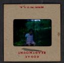 [Mimi Muray on a swing (travel slide)]