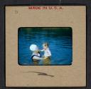 [Mimi Muray swimming with a woman (travel slide)]
