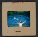 [Mimi Muray swimming with a woman (travel slide)]