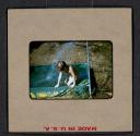 [Mimi Muray playing in a pool (travel slide)]