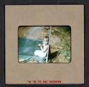[Mimi Muray playing in a pool (travel slide)]