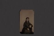[Seated man and woman posing in studio]
