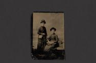 [Two women posing in studio]