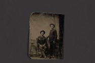 [Two men posing in studio]