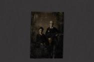 [Two men in hats seated in studio]