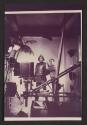 [Nickolas Muray and a man in metal armor in a studio]