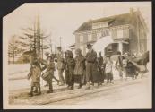 [Group of women, men and children participating in the Suffrage Hike]