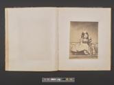 [Child holding doll]