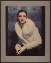 [Woman in white fur coat]