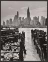 View of Downtown Manhattan from the Brooklyn Shore, a burned down pier In foreground