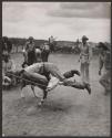 [Bill Felts taking down calf at rodeo steer roping event]
