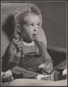 [Girl holding dish]