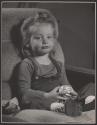[Girl holding dish]