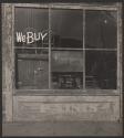 [Shop window with We BUY on upper left pane]