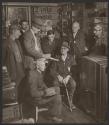 [Farmers talking at general store]