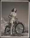 [Woman on bicycle]