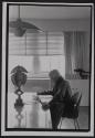 [Carl Sandburg - working on book at Arnold Newman's home]