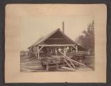 [Homestead and factory \ Men and boys with lumber]