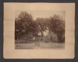 [Family in front of white house \ Family in yard in front of house]