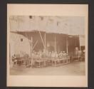 [Arab men smoking a hookah at cafe]
