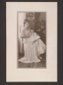 [Woman with baby on lap]