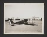 [Planes outside hanger]