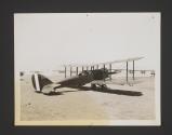 [Plane outside hanger]