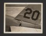 [20 on tail of plane]