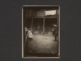 [Lewis Hine photographing children in a slum]