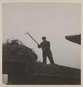 Worker with pitchfork