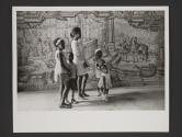 Mother with children in front of mural, Salvador de Bahia, Brazil