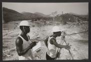 Two workers on the Volta River Project wearing hardhats, Ghana