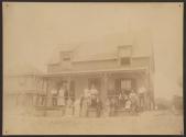 [Large group on porch of house]