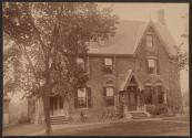[Brick house covered in ivy]