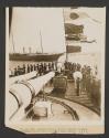 The Royal yacht passing the British Admirals flag ship S.S. Royal Sovereign; coronation naval review off Spithead, England
