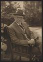 George Eastman seated outside in Vancouver