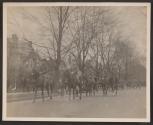 [Snapshot of officers on horses in parade]