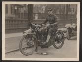 [Snapshot of soldier on motorcycle]