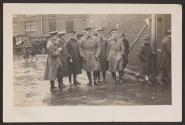 [Snapshot of military officers standing]