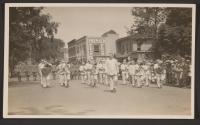 [Snapshot of military band in parade]