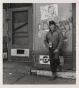 [Man in front of Pepsi sign, Buffalo, New York]