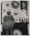 [Man with Elvis poster, Buffalo, New York]