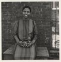 [Woman in striped dress, Buffalo, New York]
