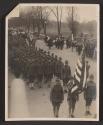 [Snapshot of soldiers and officers in parade]