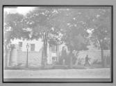 [House Surrounded By Stone Wall]