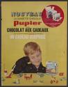 Nouveau la cassette chocolat Pupier c'est le chocolat aux cadeaux vous y trouverez d'exquises tablettes de chocolat et un cadeaux surprise (Pupier, tear sheet)