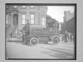 First electric truck ("Riker Electric Vehicle Co. Elizabethport, NJ")