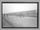 [auto driving at racetrack]