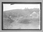 [auto approaching river crossing]