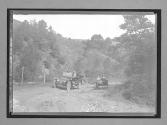 [two autos on road]
